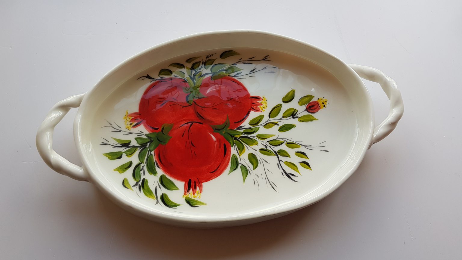 Handmade ceramic oval platter with pomegranates