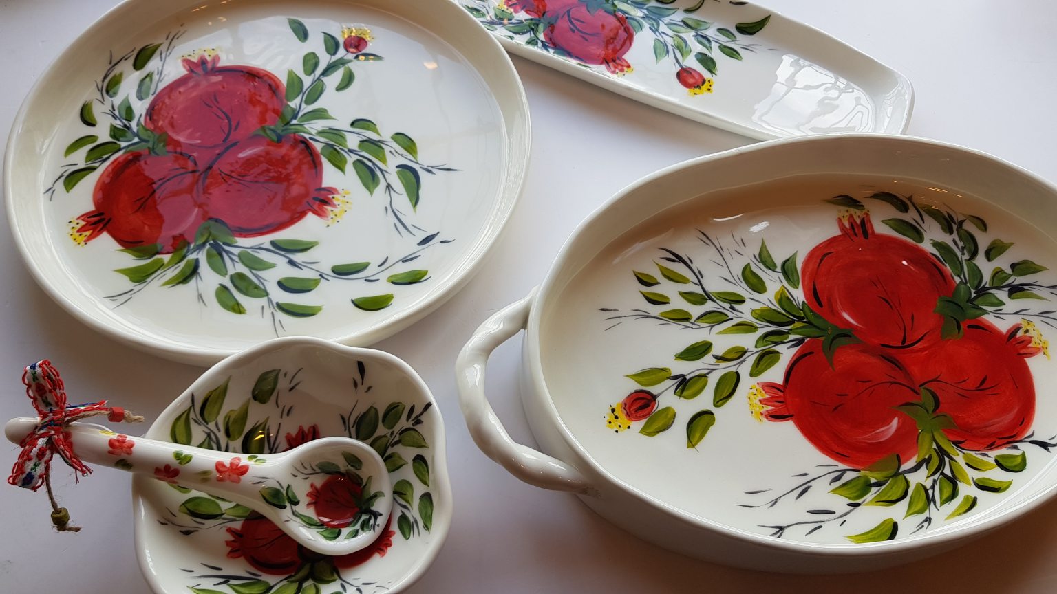 Handmade ceramic oval platter with pomegranates