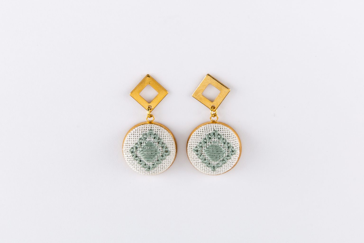 Green hand-embroidered earrings