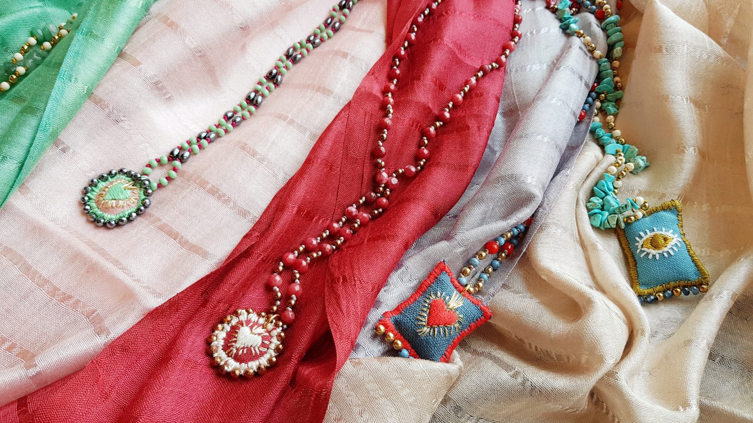 Red rosary necklace with hand-stitched heart