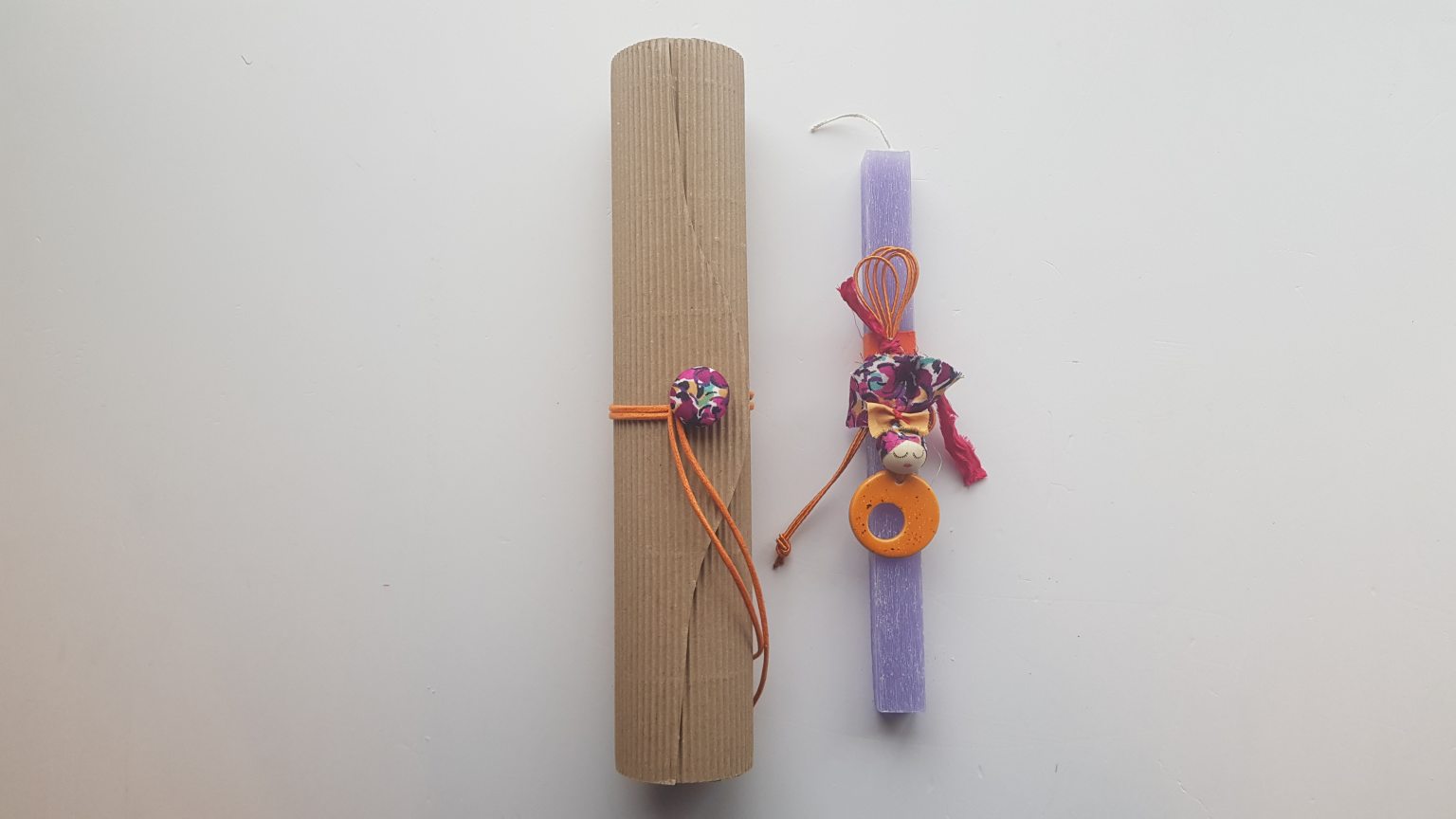 Handmade purple candle with orange pendant