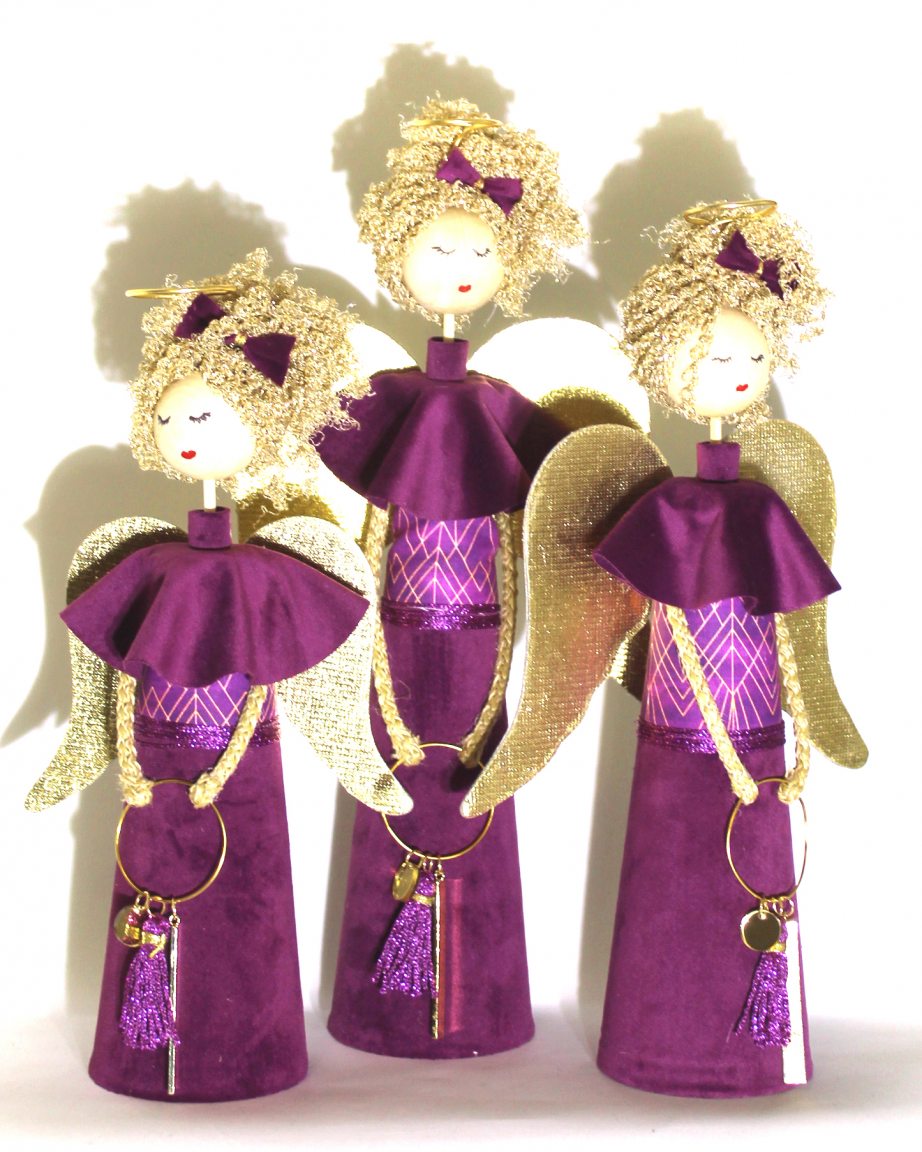 Three handmade magenta fairies