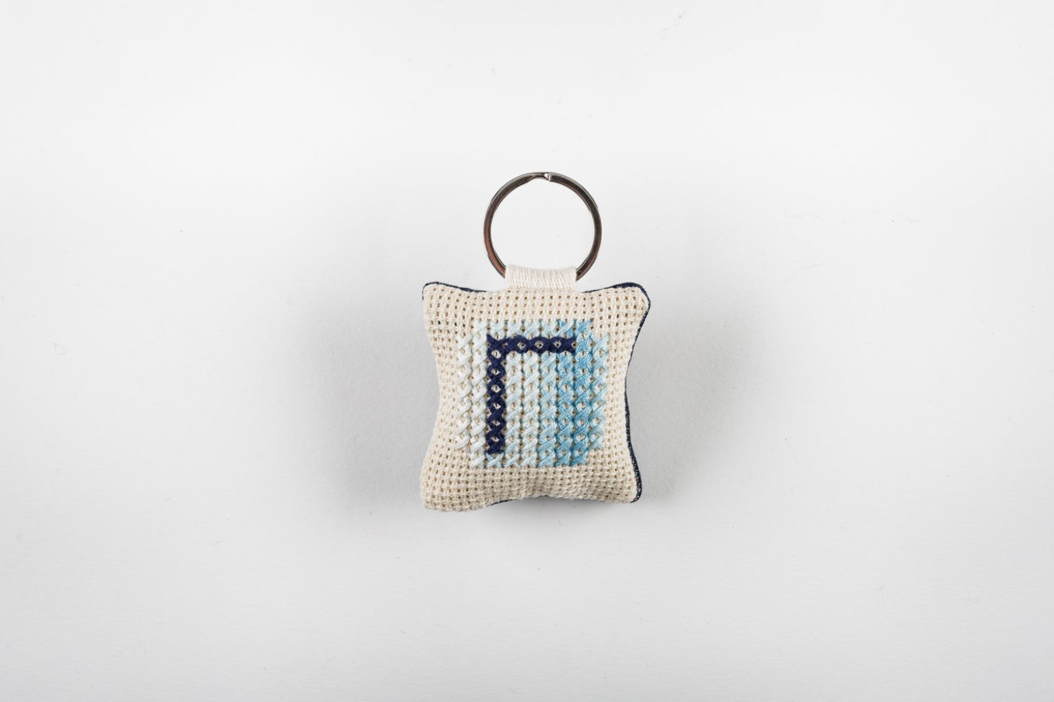 Hand-embroidered keyring with initial "Γ"