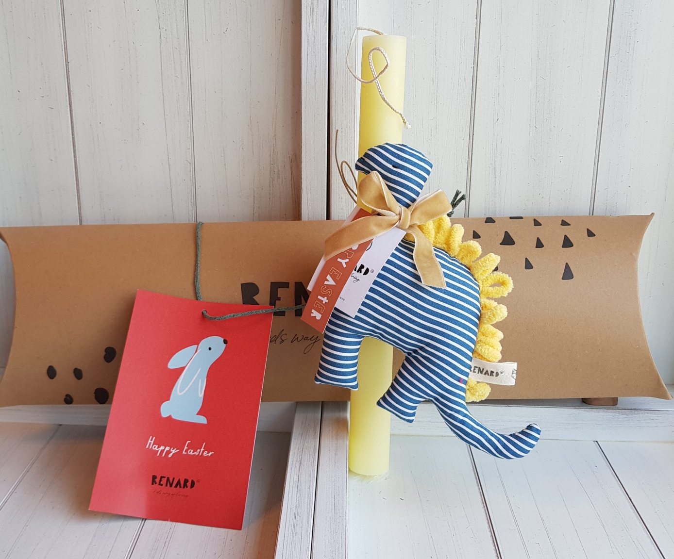 Bougie artisanale avec dinosaure rayé bleu