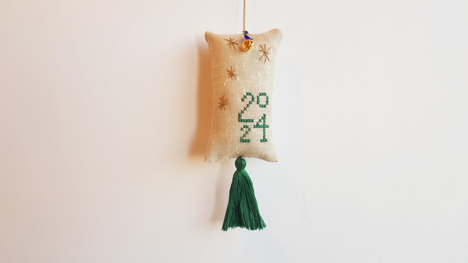 Hand-embroidered lucky-charm with "2024"
