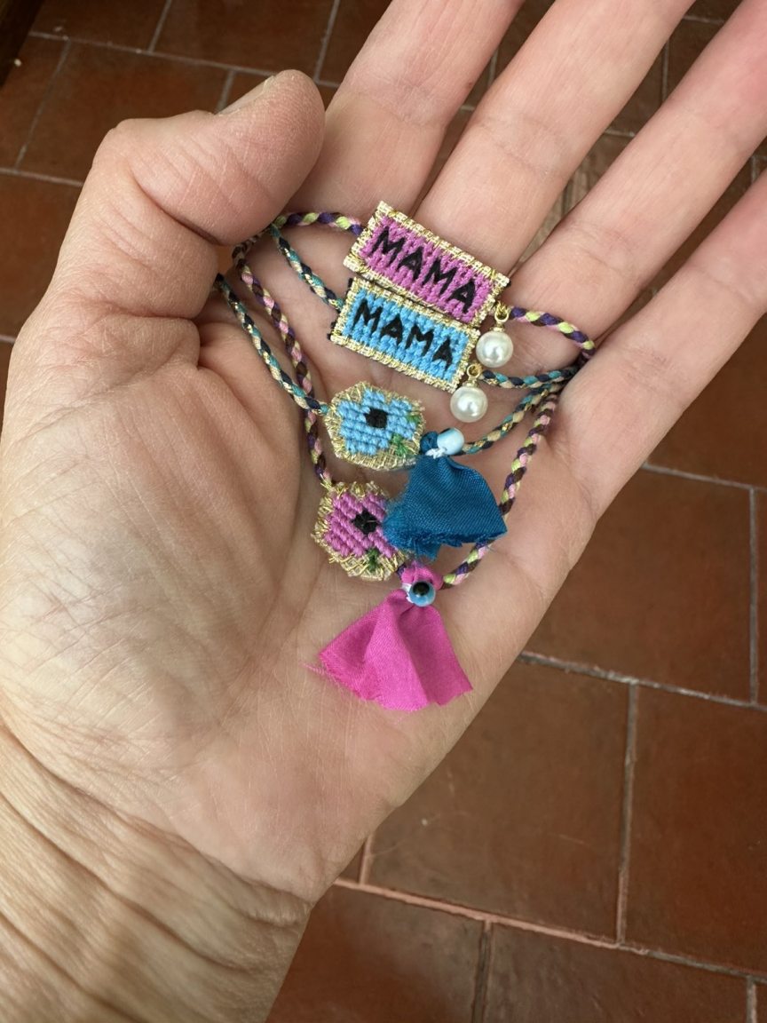 Embroidered bracelet with blue flower