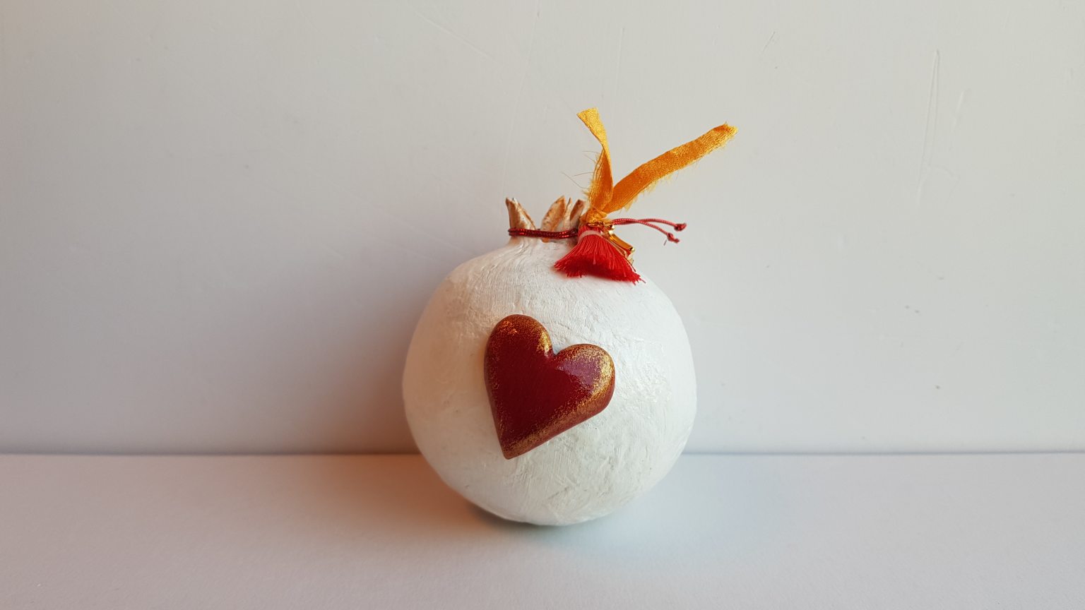 White pomegranate made of papier-mâché 