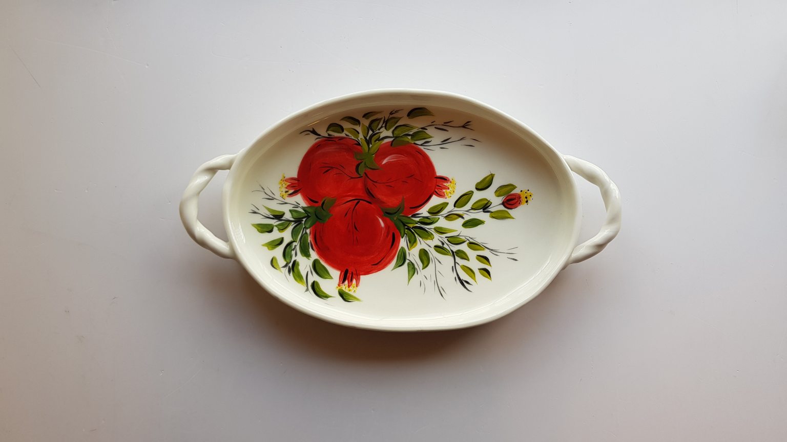 Handmade ceramic oval platter with pomegranates