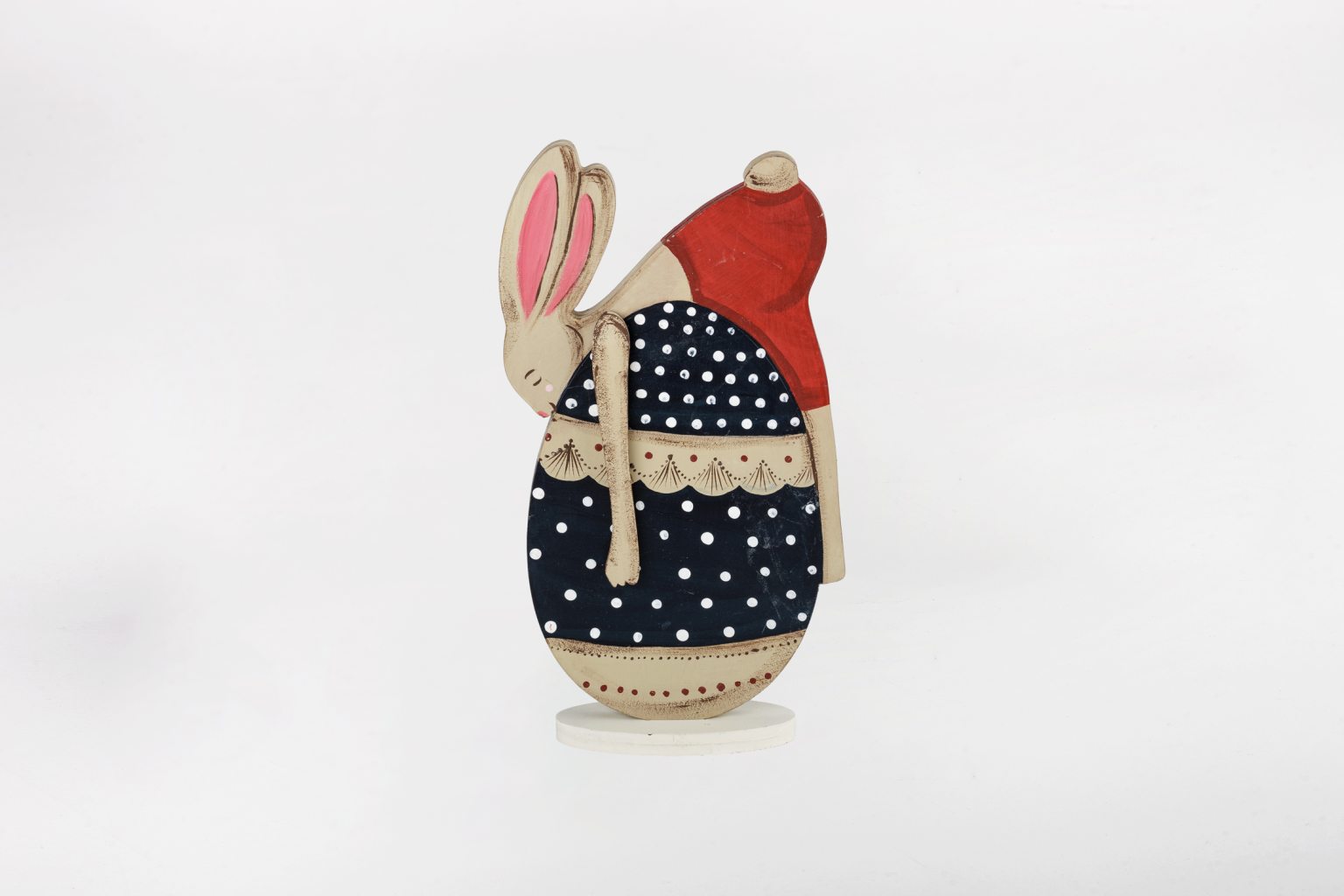 Handmade rabbit hugging its egg