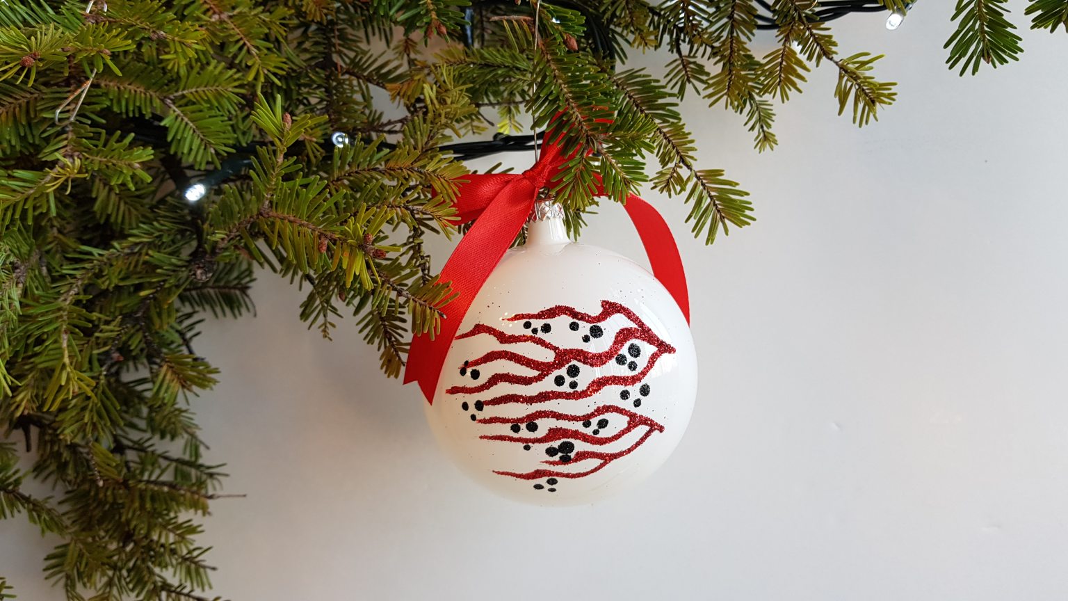Large hand-blown bauble with red branches