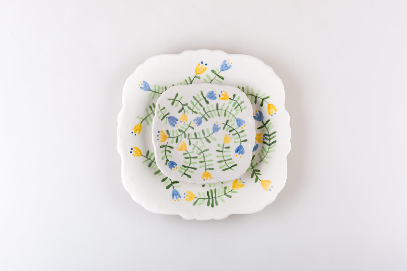 Handmade platter and matching plate with blue and yellow flowers