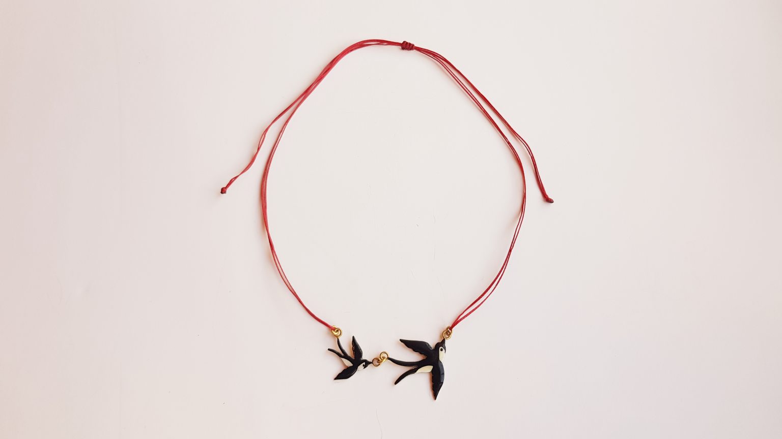 Necklace with swallows 