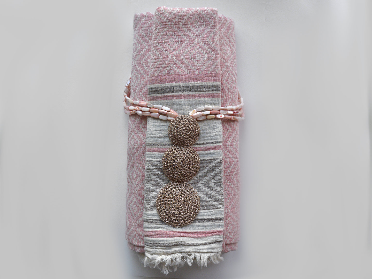 Handknitted necklace with mother of pearl beads