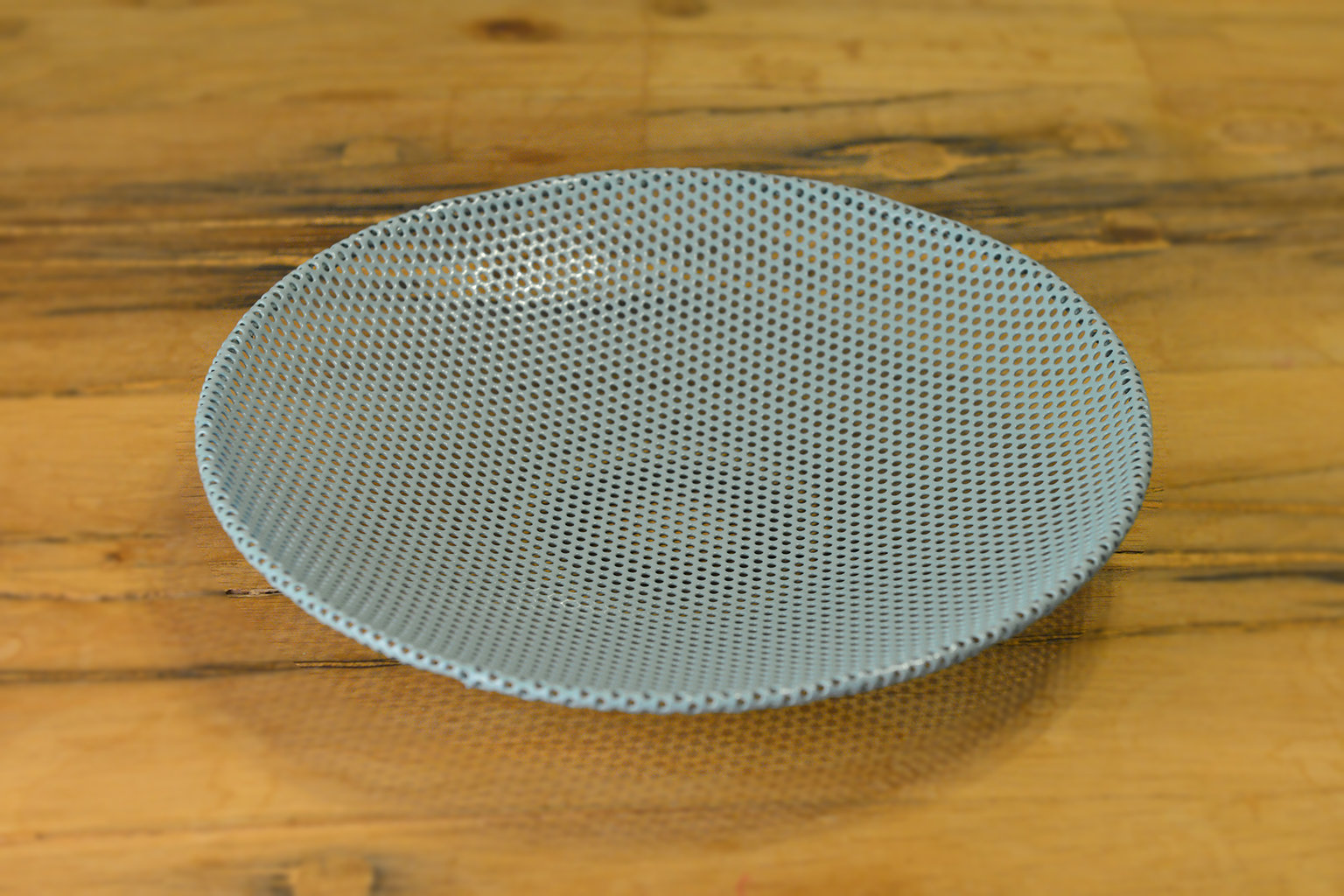 Small perforated metal platter light blue