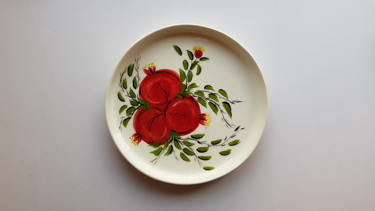 Handmade ceramic platter with pomegranates