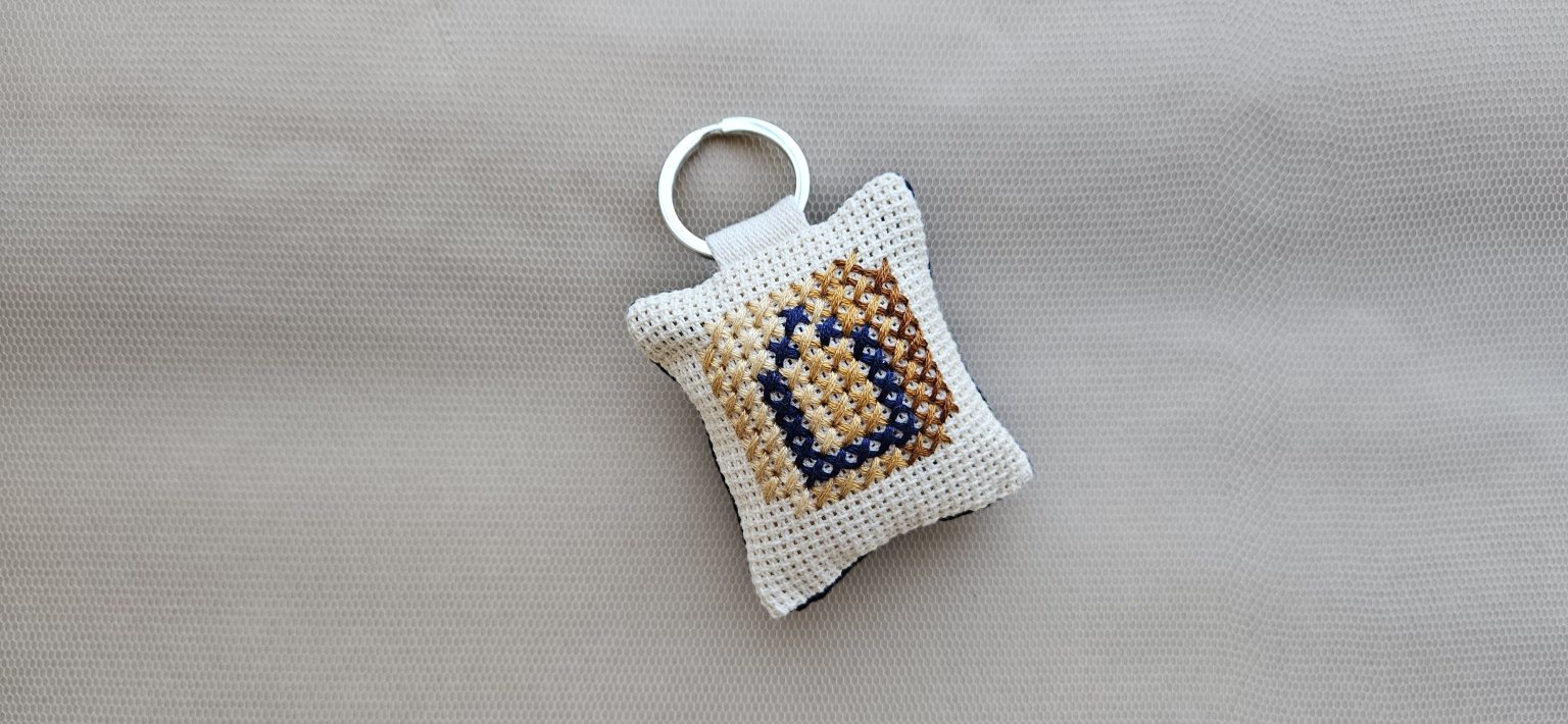 Hand-embroidered key-ring with initial "Δ"