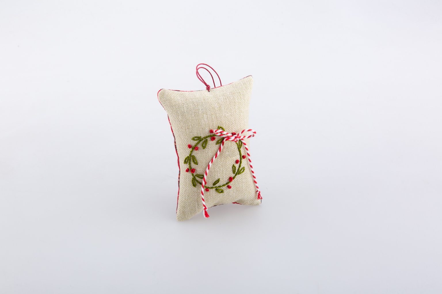 Hand-embroidered lucky-charm with wreath