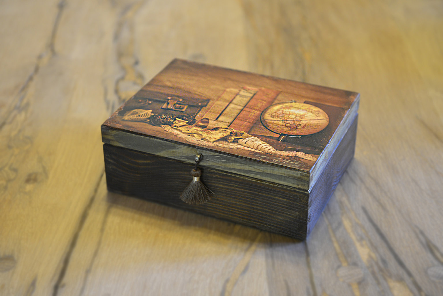 Wooden box with a chest and a globe