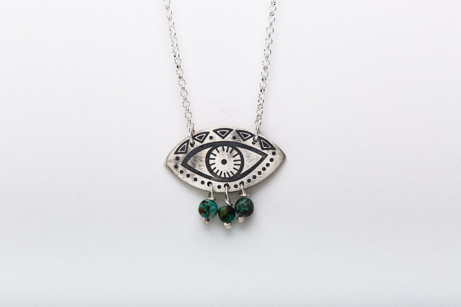 Evil-eye necklace with peridot beads