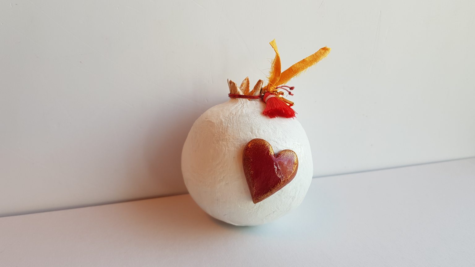 White pomegranate made of papier-mâché 