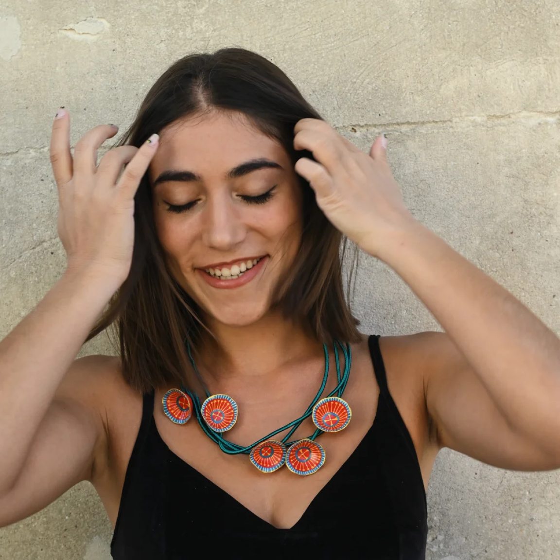 Long necklace with red and blue ornaments
