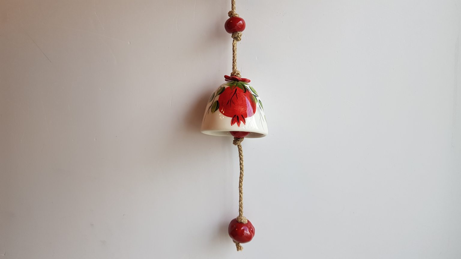 Handmade ceramic bell with pomegranates