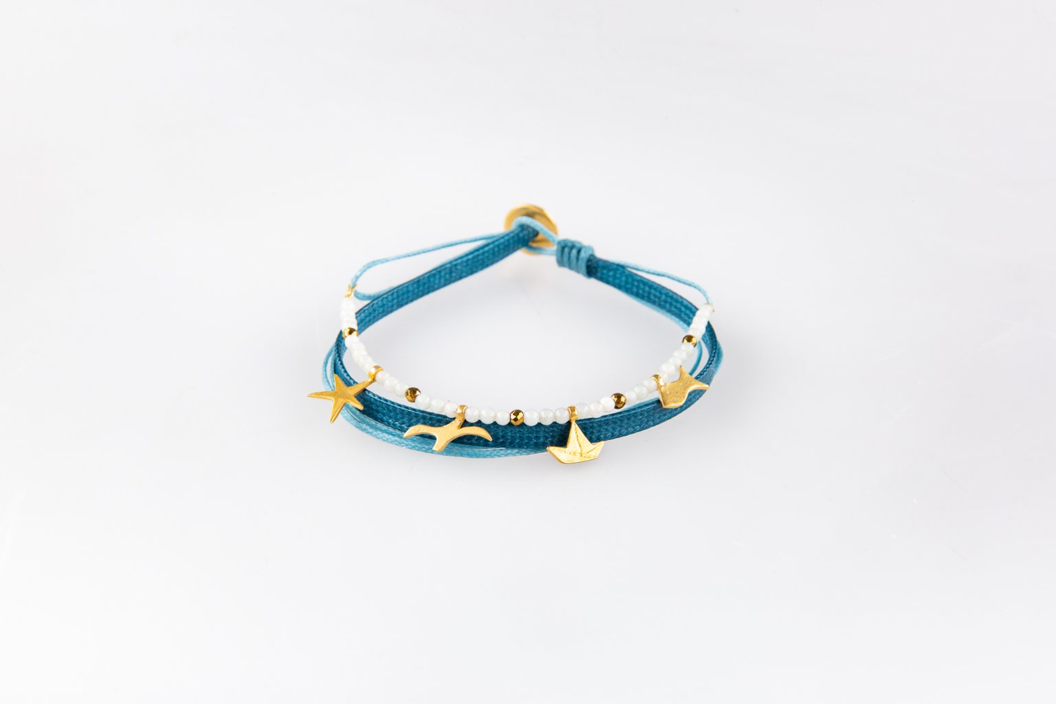 Bracelet with gold-plated charms and beads