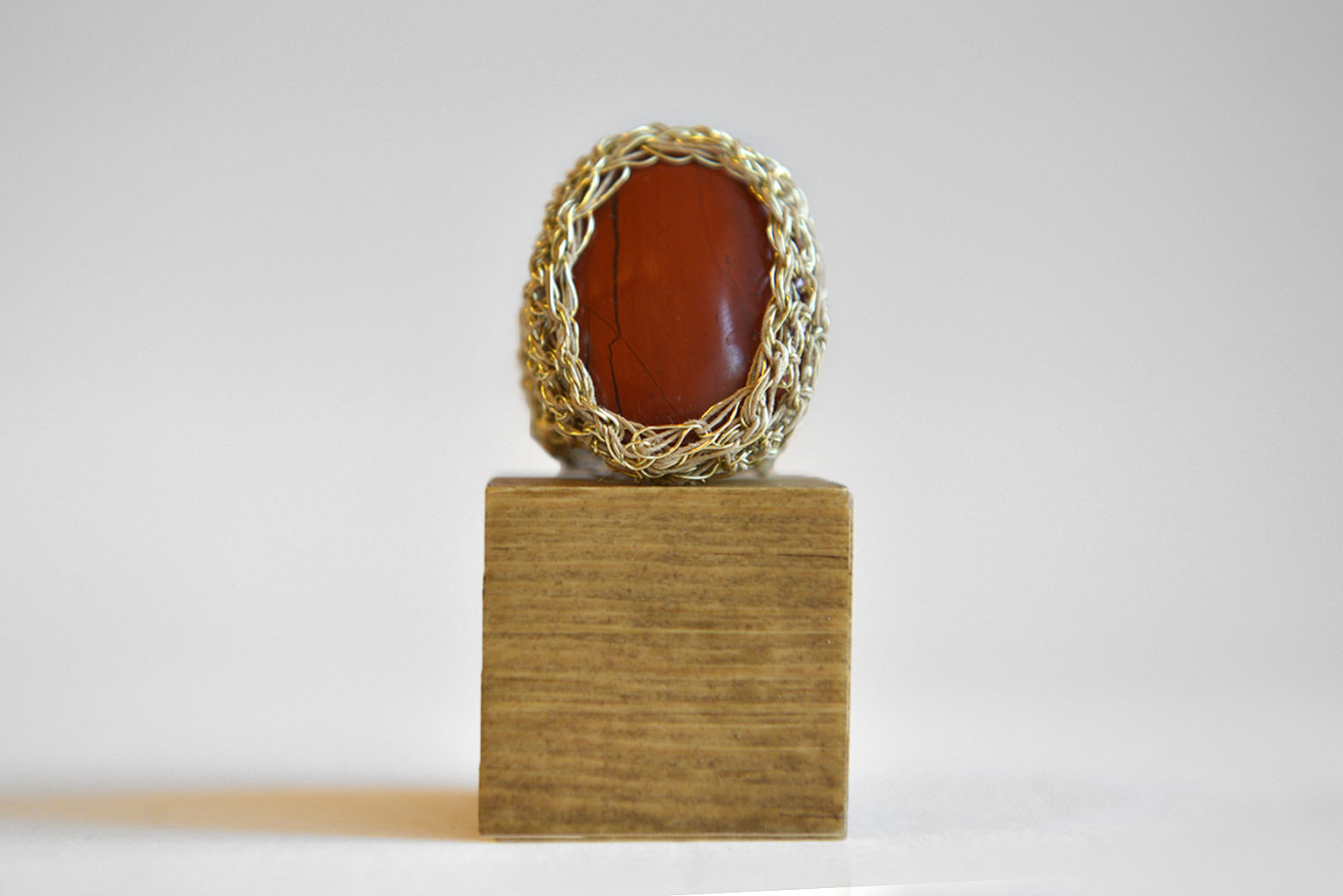 Handknitted ring with carnelian