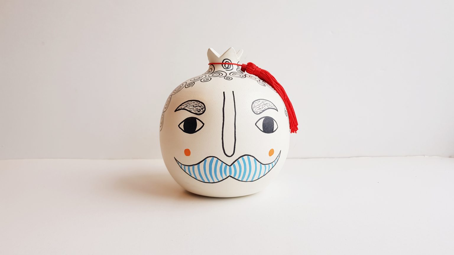 Large handmade pomegranate with a man