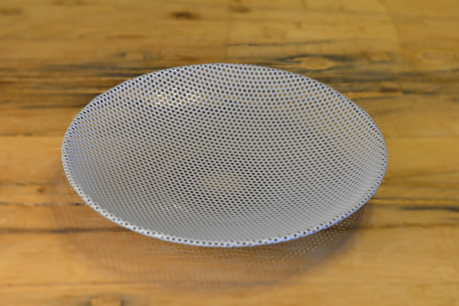 Small perforated metal platter gray