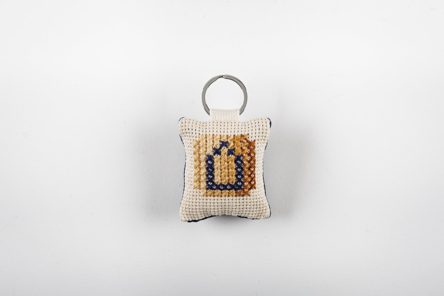 Hand-embroidered key-ring with initial "Δ"