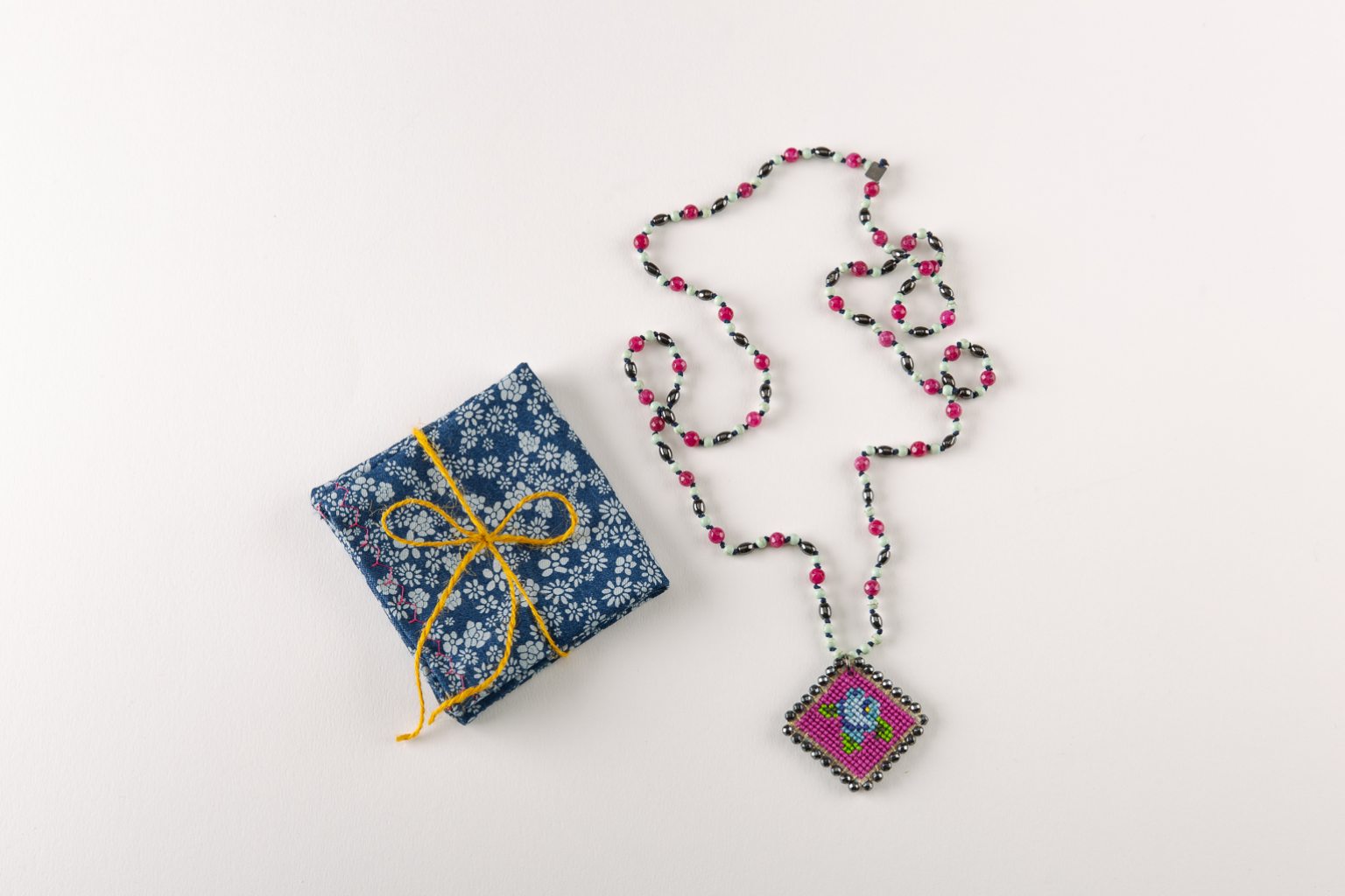 Burgundy rosary necklace with hand-stitched rose