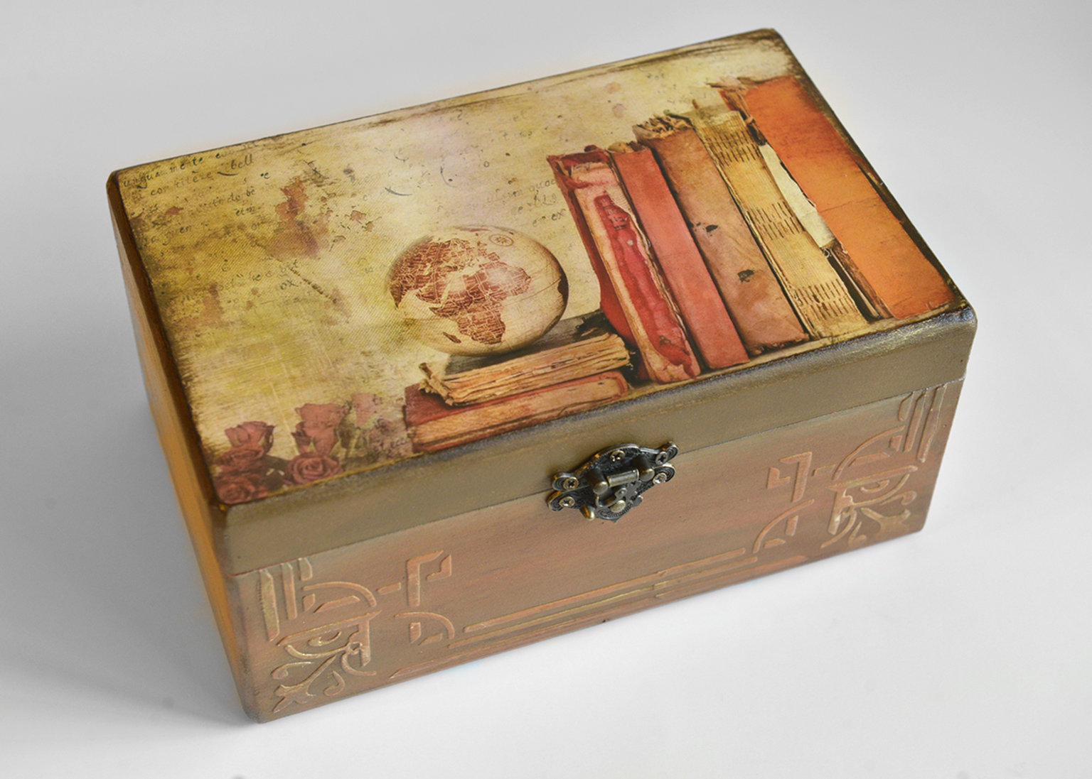 Wooden box with a globe and books
