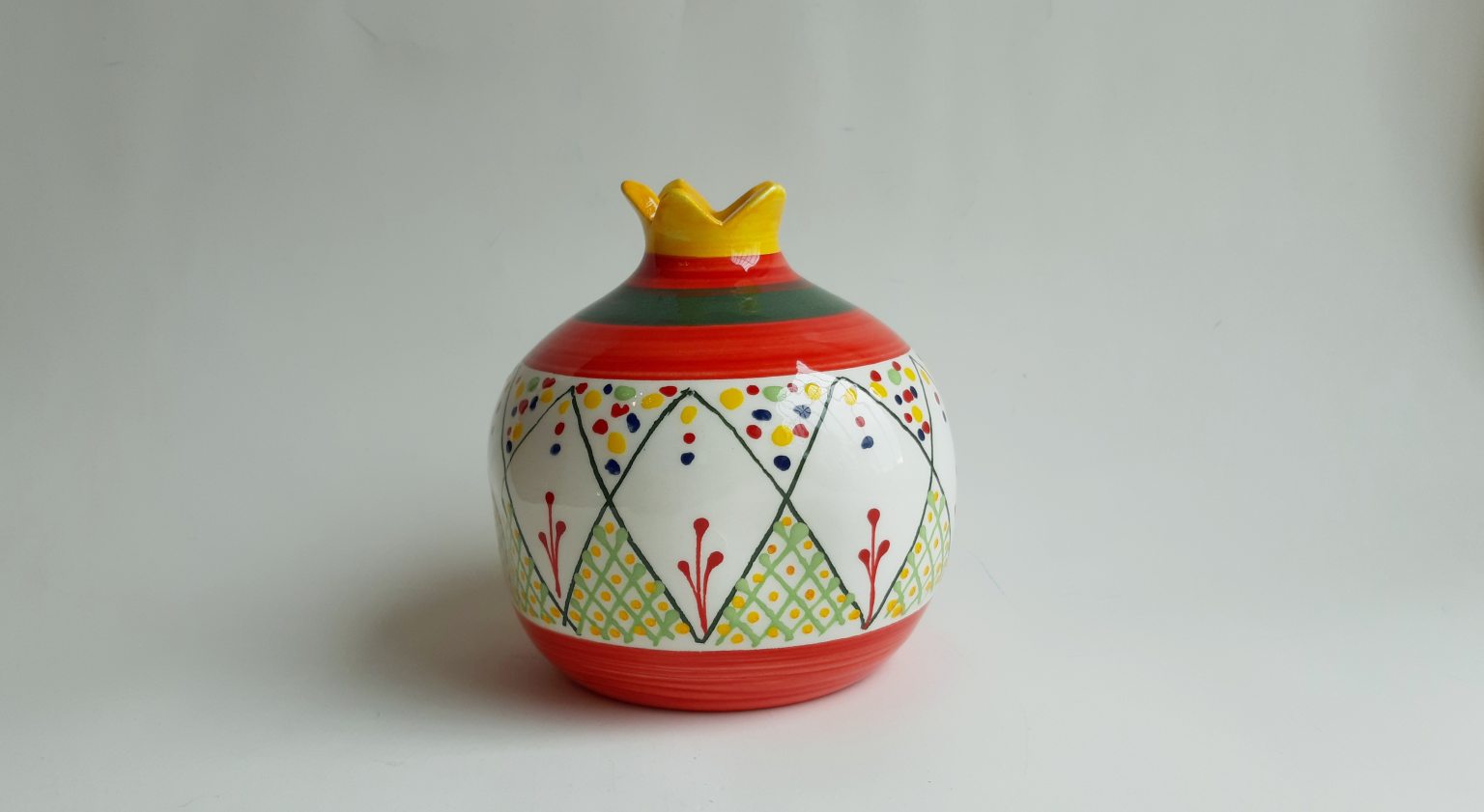 Large handmade pomegranate with linear pattern